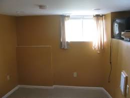 Basements the best colour palettes to brighten a basement monochromatic for the win Dark Orange Paint Color In The Basement Bedroom