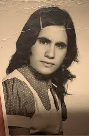 Can someone edit this photo of my mom and remove the boy. It's for her  funeral please. Brighten and enhance if possible