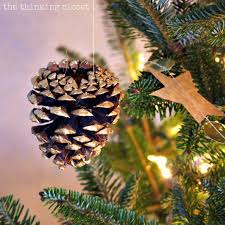 A favourite, these look lovely grouped together in a pine cones look great just dipped or painted in full gold or silver paint. Gold Brushed Pine Cone Ornaments With Myfavoritebloggers The Thinking Closet