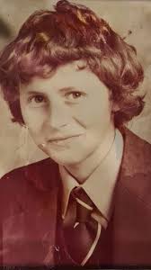 Please could one of you lovely people make this back to colour. He had  brown hair and the shirt was white with bottle green jacket and tie. Thank  you so much