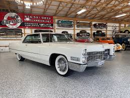 Image result for Starlight Silver 1966 Cadillac