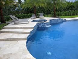 Connect the bridge to a private garden to emphasize a relaxed feel. South Florida Swimming Pool Renovation Photo Gallery
