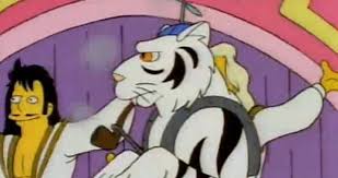 Robots fill the town, buildings are on fire and homer is wearing armour while holding a rifle. The Simpsons Disturbing 2021 Prediction And Worrying Events They Spookily Got Right Mirror Online