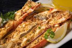How do you split crab legs before grilling them?