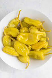 Not quite a banana pepper, not quite a sweet bell pepper, and not really a hot chili pepper either, pepperoncinis are really a thing unto themselves. Pepperoncini Peppers All About Them Scoville More Chili Pepper Madness
