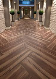 Hotel Corridor Featuring Affinity255 Smoked Walnut Vinyl Flooring In Herringbone Pattern Vinyl Flooring Flooring Wood Floor Design