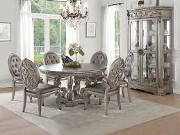 A dining room is a room for consuming food. Northville Antique Silver Round Dining Table