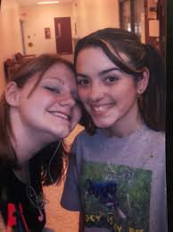 One of her favorite Buddies in school ..Id say he was just a little taller  than her ... friends for 12 years and graduated together . THESE ARE SOME  OF MY FAVORITE