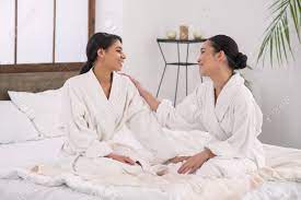 Lesbian Partners. Happy Attractive Woman Looking At Her Partner While Being  In The Spa Salon Together With Her Stock Photo, Picture and Royalty Free  Image. Image 99988226.