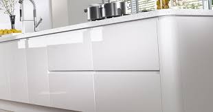 Features include a breakfast counter, sprayed conversion lacquer coating and caesar stone counter tops with a waterfall edge. Matching High Gloss White Kitchen Doors Kitchen Warehouse