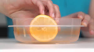 Step 1 rinse the item with cold water (hot water may cook the stain into the plastic, making it more difficult to remove). How To Use A Lemon To Clean Stained Food Containers Real Simple Youtube