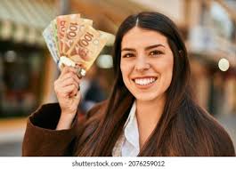 3+ Hundred Person Holding Cash Canada Royalty-Free Images, Stock Photos &  Pictures