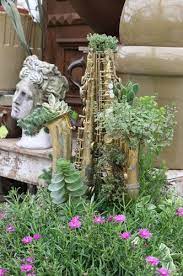 Put Your Old Musical Instruments To Use Playing A New Tune In Your Garden Flower Garden Music Decor Garden