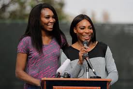 Venus williams poses with the women's singles championship trophy as her sister, serena, applauds during the trophy ceremony. Serena Williams Loves Dancing As A Workout During Her Off Season I Really Enjoy That People Com
