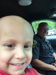 Today “Cops for Kids with Cancer” held a fund raising event at the Blue  Hills Country Club in Canton. In attendance were Maddox Tocchio and his  father Chris Tocchio to receive a