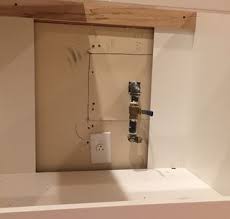 Follow similar procedure making sure cabinet is supported until fully fastened to the wall. Is It Standard Acceptable To Leave Drywall Bare Behind Kitchen Cabinetry Home Improvement Stack Exchange