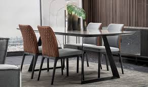 Dining tables are round, square, rectangular, or triangular and with tops of tempered clear glass, painted glass or wood veneer, fixed or extendable. Toronto Saloni
