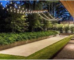 Lighting And Comfortable Seating Along The Side Are Key Elements To A Well Designed Beautiful And Terrain Petanque Terrain Boule Petanque Amenagement Jardin