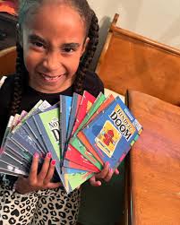 My babygirl is a reader! 🙌🏾 Just finished the #notebookofdoom &  #binderofdoom series by @troxcummings. She burned through them, sometimes  finishing multiple books in a day. We watched a Troy Cummings talk