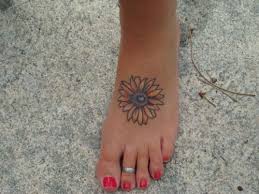 The sunflower is unusual because it is painted in different colors and it is only a half of the flower. 140 Staggering Sunflower Tattoo Designs Creativefan