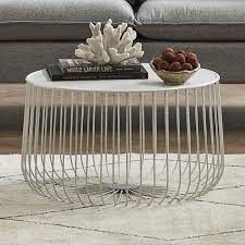 You can try to match your living room table with the rest of your furnishing. Temple Webster Trevi Wire Coffee Table