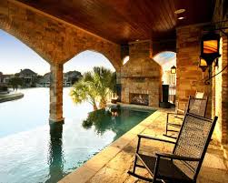 Zbranek Holt Custom Homes Love The Fireplace At The End Of The Infinity Edge Pool Lake House Outdoor Pool