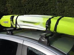 Stretchable film with transparent tape gets supported by some straight, fresh, solid tree branches. How To Transport Canoes Kayaks An Informative Guide From The Canoe Shops Group