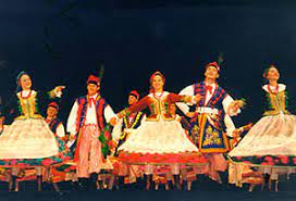 The folk outfit worn for the dance has become the national costume of poland, most notably, the rogatywka peaked hat with peacock feathers. Krakowiak Cracovienne Polish Music Center