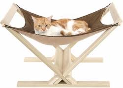 This cat bed hammock instantly suctions to any window, offering a comfy, secure, elevated perch for your cat to sleep beneath warming sunbeams, while staying off furniture. Cat Hammock Cat Hammocks Cat Beds Cat Scratcher