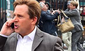 Steve Carell sports newly blond locks as he yells into his phone while  fighting for a cab