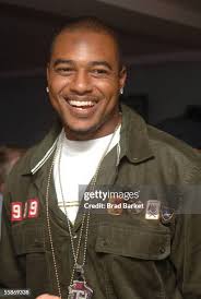 Cornerback Eric Warfield and Running back Larry Johnson pose for a... News  Photo