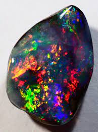 This opal usually exhibits a bright display of black opal color. Boulder Opal