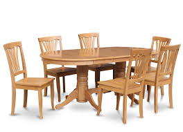 It is accompanied by wooden cabinetry and a bar paired with metal stools. Oval Dining Table For 6 Ideas On Foter