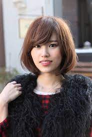 Basically someone who shows off their forehead is said to have a big head i.e. Messy Medium Bob With Long Sexy Fringe Simple Easy Daily Asian Bob Cut Hairstyles Weekly