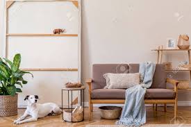 Coffee table features choose a coffee table that fits your style and your needs. Interior Design Of Living Room With Stylish Brown Wooden Sofa Macrame Bookstand Lamp Coffee Table Plants Decoration And Elegant Accessories Beige And Japandi Concept Template Stock Photo Picture And Royalty Free Image