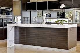 Whereas a traditional countertop is composed of a single horizontal surface that ends at the edge of a peninsula, island or bank of cabinets, the waterfall countertop descends vertically down the side or sides, creating an unbroken flow to the ground. Cheap Waterfall Islands Kitchen Google Search Our New Home Kitchen Island Bench Contemporary Kitchen Island Waterfall Island Kitchen