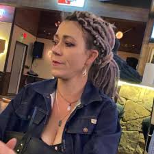 The 40-year-old is suspected of shooting and killing a woman who had been  arrested