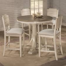 Find the perfect home furnishings at hayneedle, where you can buy online while you explore our room designs and curated looks for tips, ideas & inspiration to help you along the way. Hillsdale Clarion 5 Piece Counter Height Dining Set With Round Table Novello Home Furnishings Pub Table And Stool Sets
