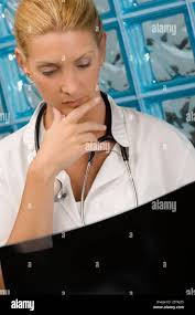 Doctor checking x ray hi-res stock photography and images