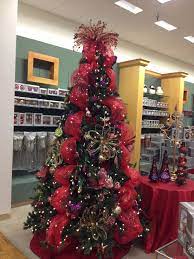 I saw these trees on pretty ditty and l.o.v.e.d. Garden Themed Christmas Tree Red Purple And Gold With Butterflies And Fl Christmas Tree Decoration Ideas Red Red Christmas Decor Christmas Stairs Decorations