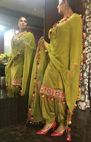 Punjabi Salwar Suit In Beautiful Mehendi Color Semi Stitched Silk Fabric With Pom Pom Patiala Suit Designs Punjabi Suits Designer Boutique Punjabi Outfits