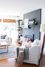 Basket wall decor with bohemian design. Boho Farmhouse Living Room Source Guide The Happy Housie