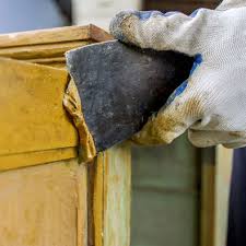 The first step for removing stain from a wood surface is cleaning it with some warm, soapy water. How To Refinish Wood Furniture