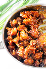 The crispy chicken is tossed in a sweet sauce then served over rice and topped with sesame seeds and/or green onions. Sticky Sesame Crispy Cauliflower The Twin Cooking Project By Sheenam Muskaan