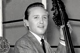 Rare photo of bass player with electric bass