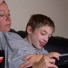 Single mother says she fears 'institutionalising' disabled son after NDIS  cut financial support