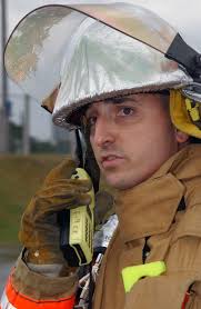 U.S. Air Force TECH. SGT. Joe Allen, a firefighter with the 18th Civil  Engineer Squadron, uses a radio to relay information from an"accident"scene  during Full Spectrum Threat Response Exercise (FSTRE) at Kadena