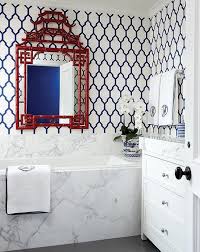 Navy Blue And Red Bathroom Features Walls Clad In Navy Moroccan Trellis Wallpaper Lined With A Red Bathroom Red Bathroom Feature Wall Bathroom Interior Design