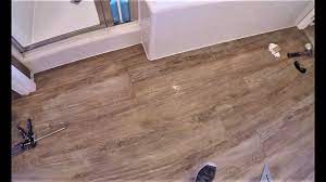 Allow 10 percent additional flooring for matching and waste. How To Install Rigid Core Vinyl Plank Flooring Against Tub Shower Step By Step Youtube