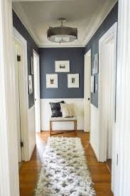 Friday Favorites 2 23 2019 Love This Idea For Decorating In A Hallway Navy Upper Walls White Lower And A Small Bench With P Interior Home Hallway Decorating